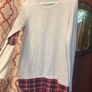 A trendy long sleeve plaid and cream shirt